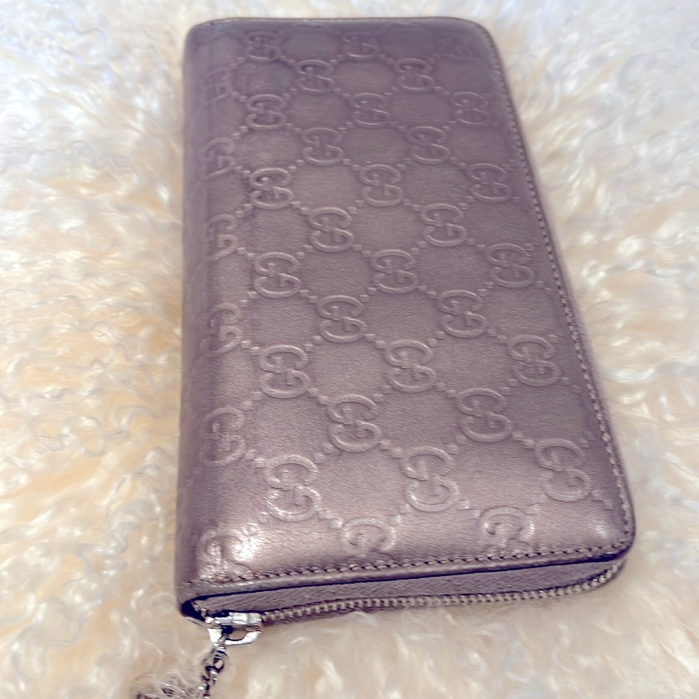 Metallic lavender Gucci large full zip wallet.